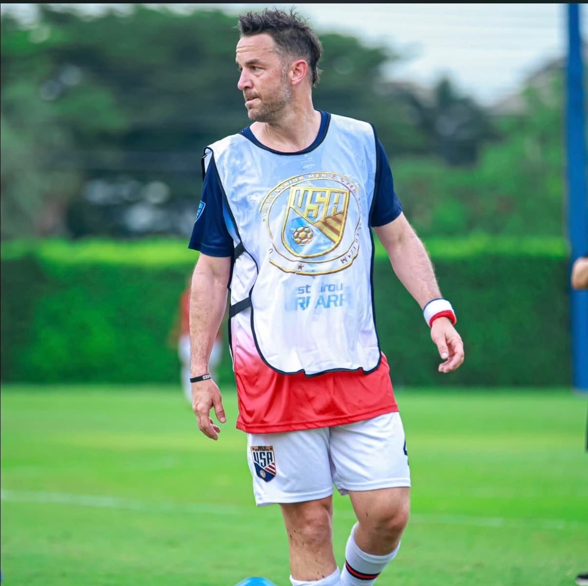 Apex founder and coach Jack Pocorobba on the soccer field representing the United States senior team