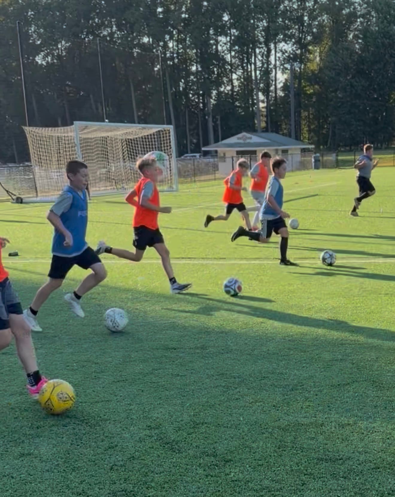 Players moving and training together on the soccer field